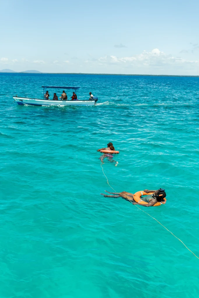 People swimming in the middle of the ocean