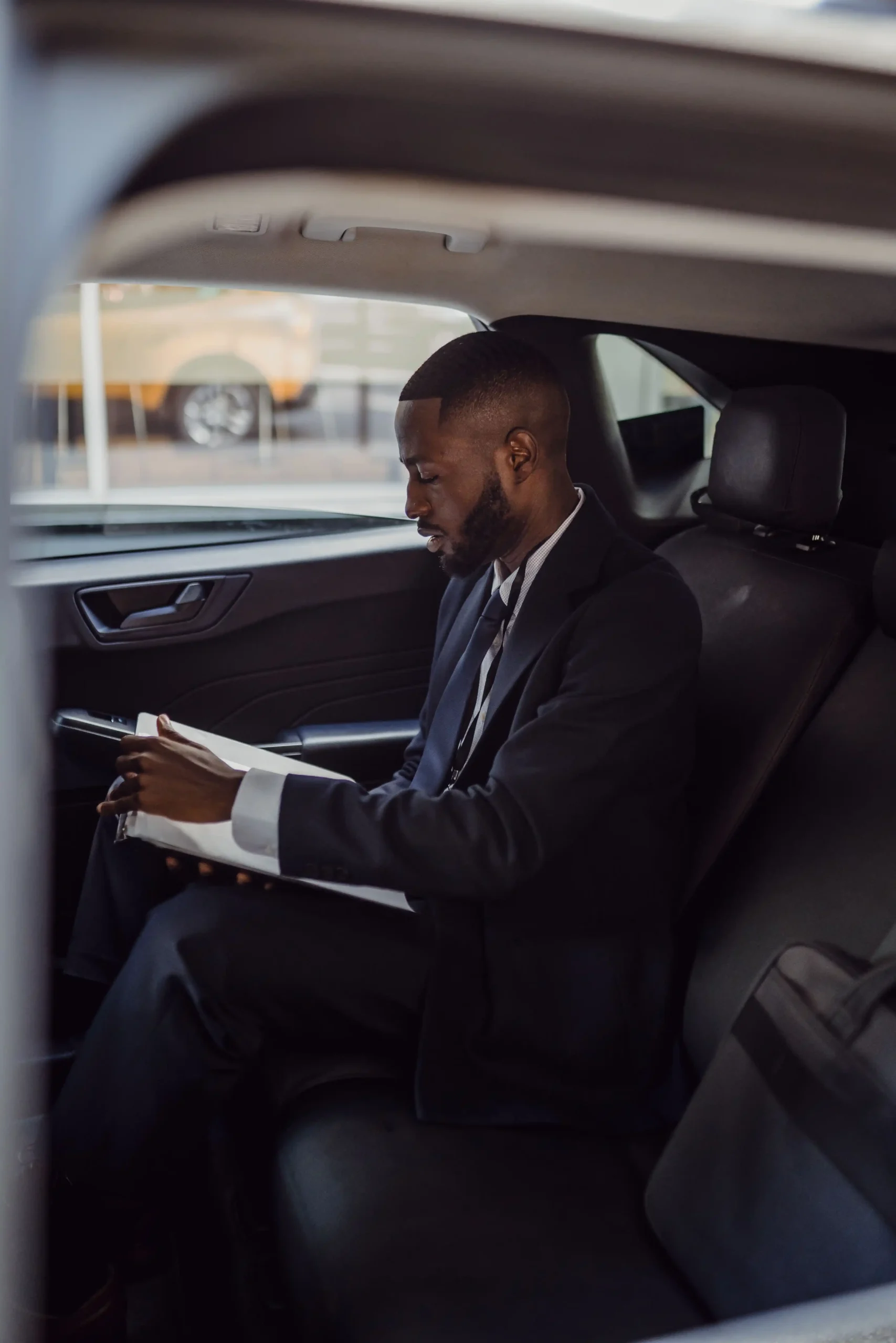 corporate guy in a taxi